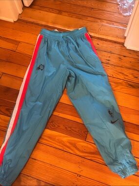 Nike Teal wind pants with Pink & White Side Stripes